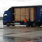 International transport delivering export packed cargo airside to meet chartered  Antonov 124 for urgent air freight shipment